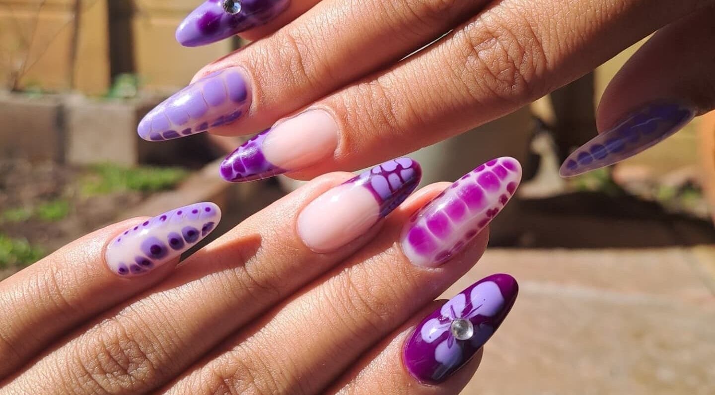 Elegant purple nail art design at Nailed by Chels in Cape Town, Western Cape, ZA, showcasing creativity and style.