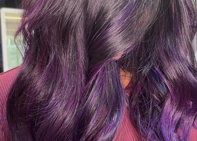 Purple ombre hair styling at Malimou, Endeavour Hills, Victoria, AU. Vibrant color highlights enhance wavy hair.