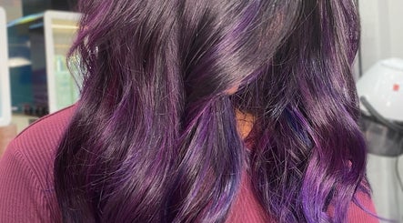 Purple ombre hair styling at Malimou, Endeavour Hills, Victoria, AU. Vibrant color highlights enhance wavy hair.