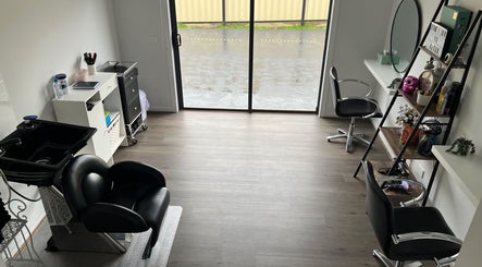 Chic hair salon interior at Malimou, Endeavour Hills, Victoria, AU with sleek furnishing and bright appeal.