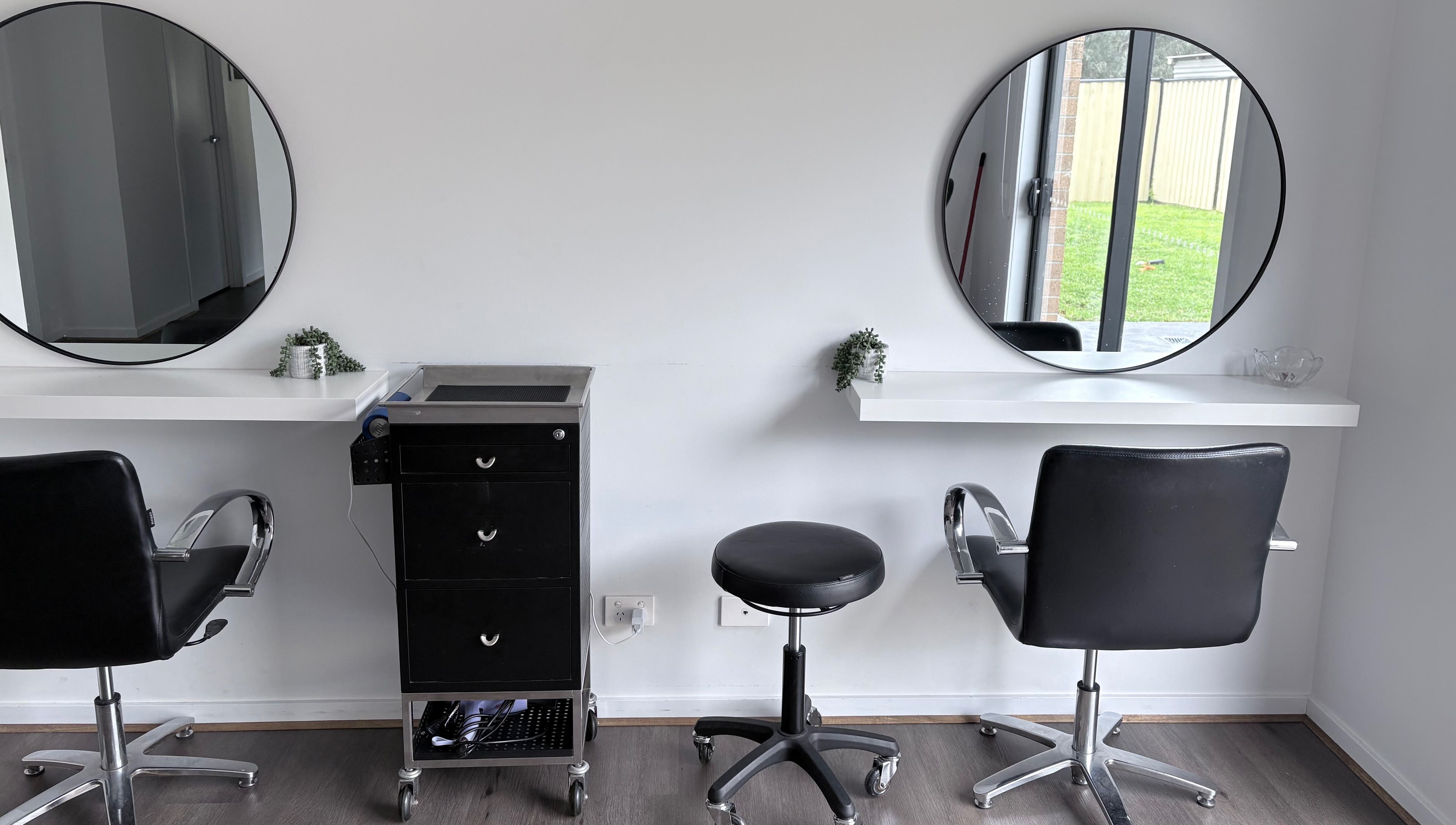Elegant salon chairs and mirrors at Malimou in Endeavour Hills, Victoria, AU.