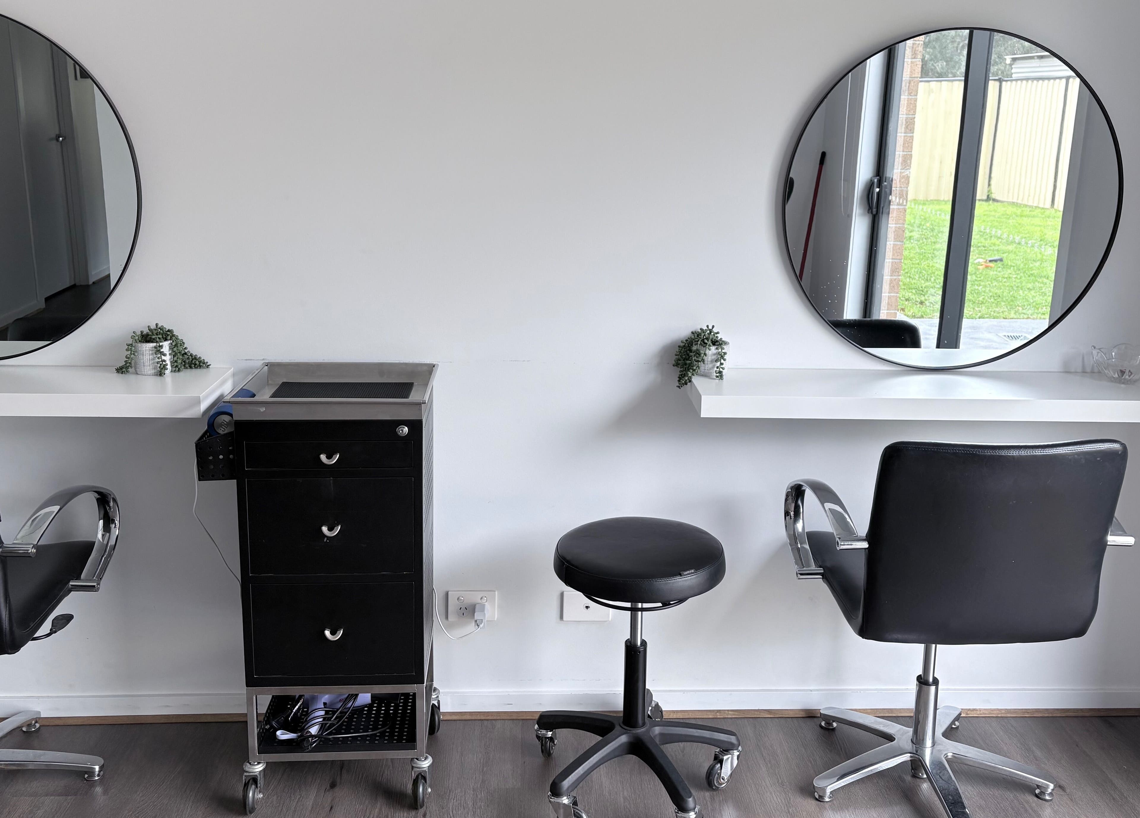 Elegant salon chairs and mirrors at Malimou in Endeavour Hills, Victoria, AU.