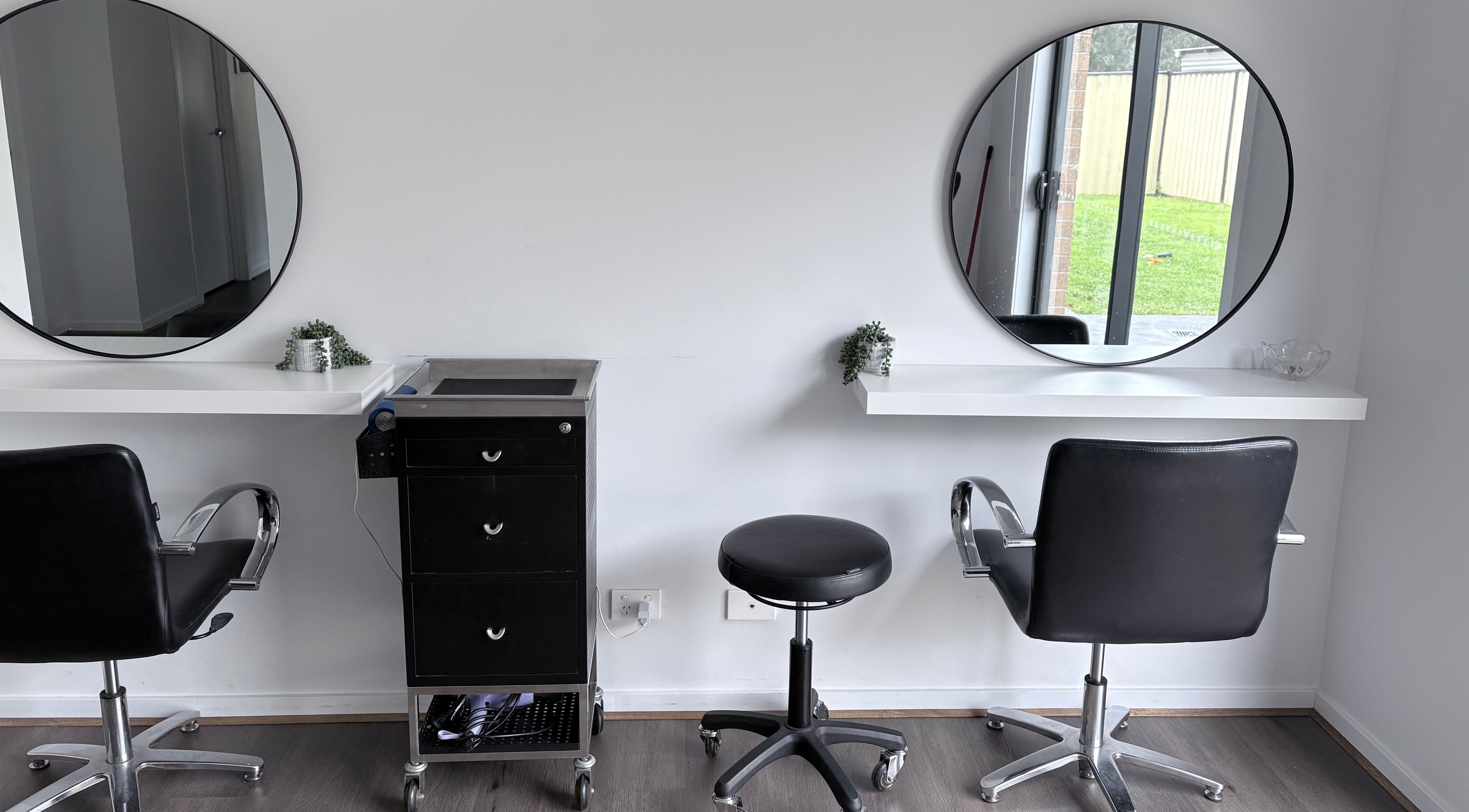 Elegant salon chairs and mirrors at Malimou in Endeavour Hills, Victoria, AU.