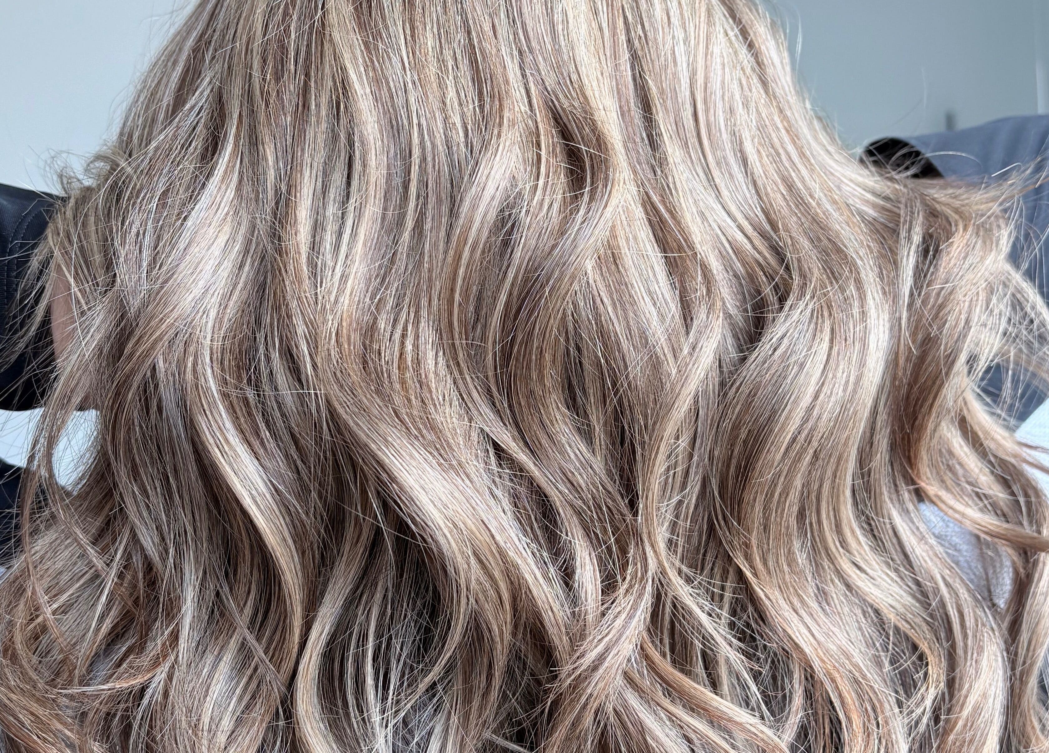 Lustrous wavy hair styled at Malimou, Endeavour Hills, Victoria, AU.