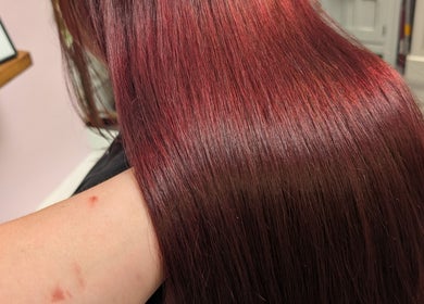 Smooth, vibrant red hair styled at Locks by Laura - Salon Studios and Co. in Washington, England, GB.