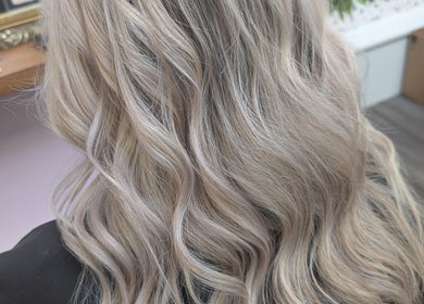 Blonde wavy hairstyle at Locks by Laura - Salon Studios and Co., Washington, England, GB.