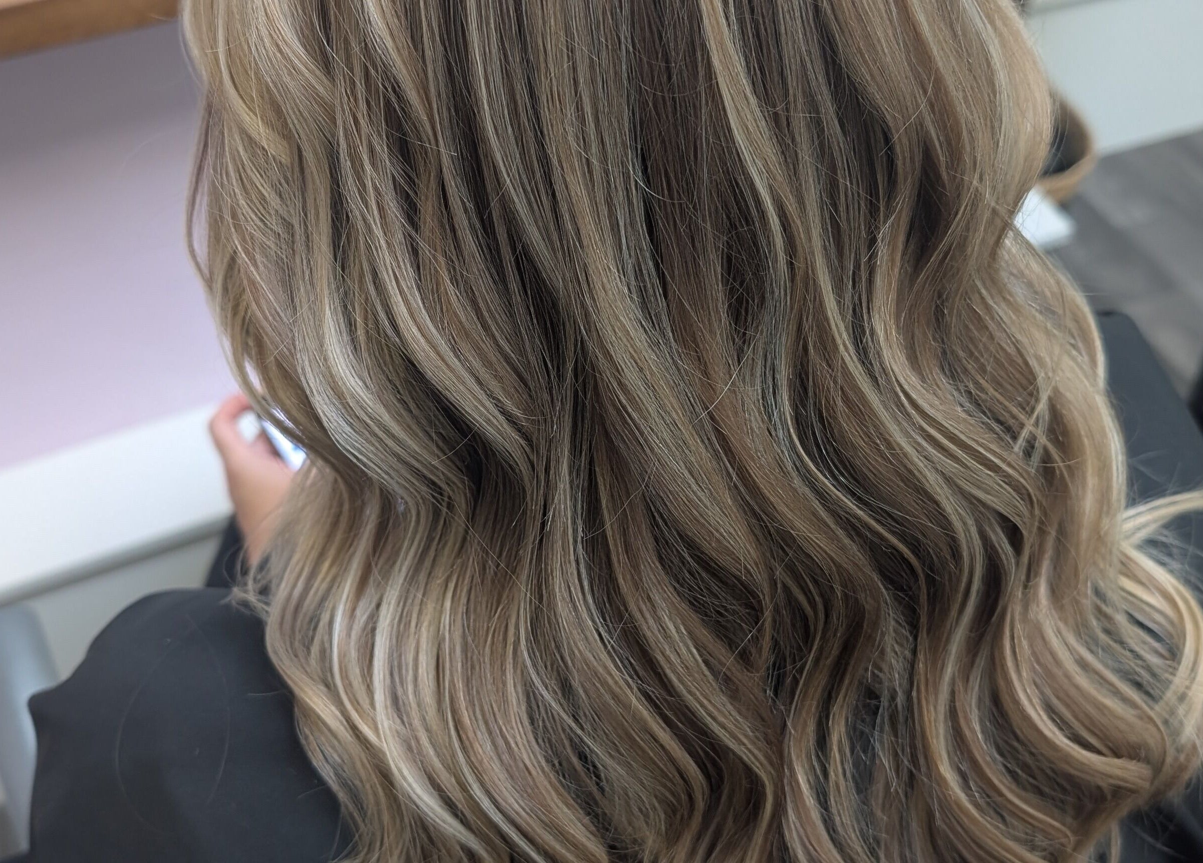 Elegant wavy hairstyle at Locks by Laura - Salon Studios and Co. in Washington, England, GB.