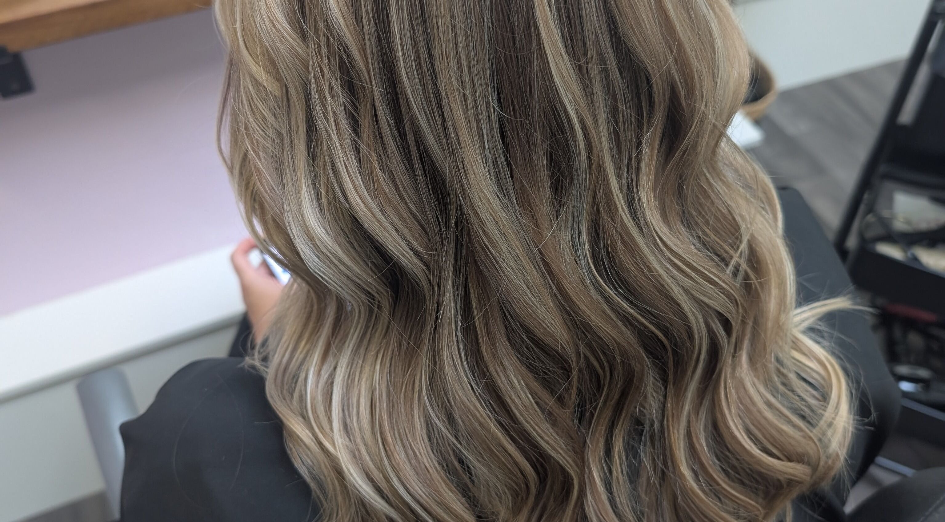 Elegant wavy hairstyle at Locks by Laura - Salon Studios and Co. in Washington, England, GB.