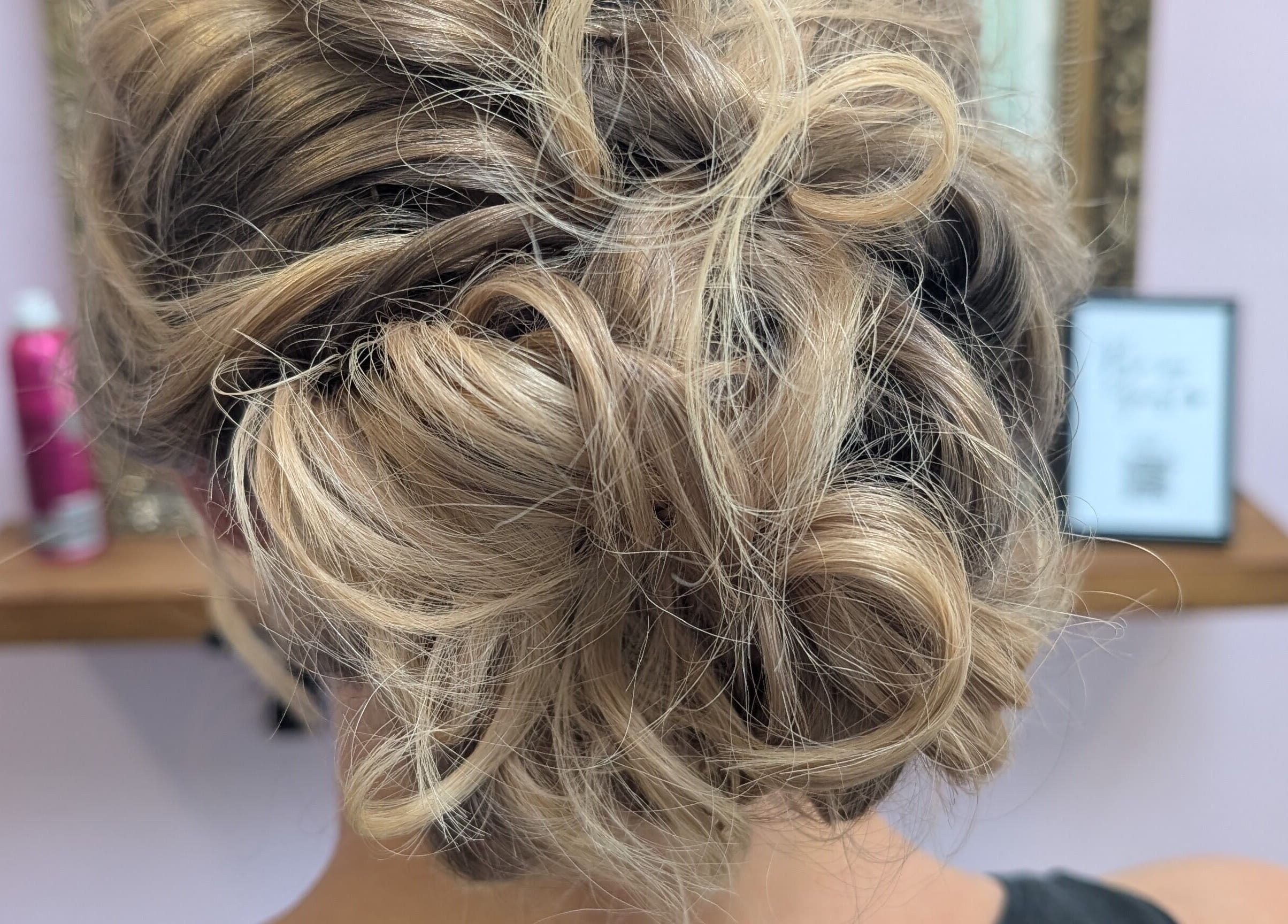 Blonde elegant updo hairstyle at Locks by Laura - Salon Studios and Co., Washington, England, GB.