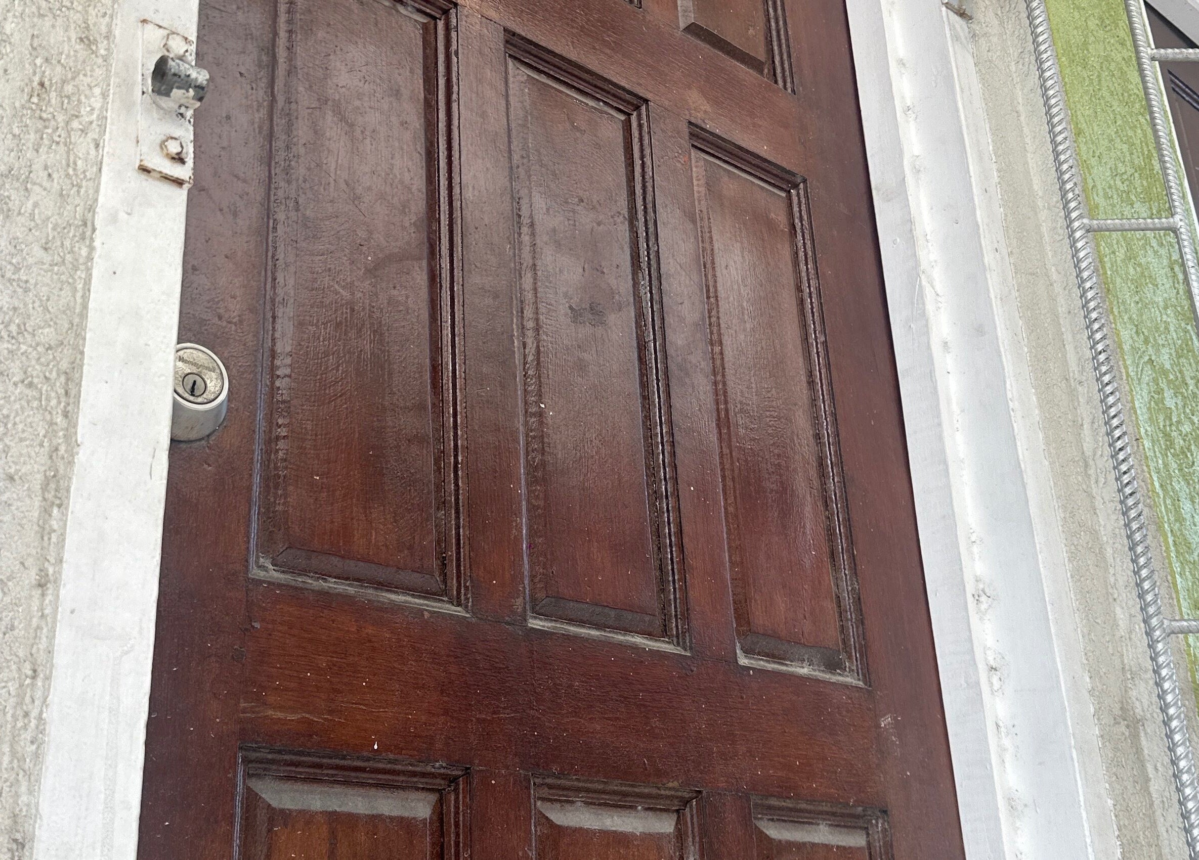 Wooden door entrance of Beauty Canvas Studio, Georgetown, Demerara-mahaica, GY.