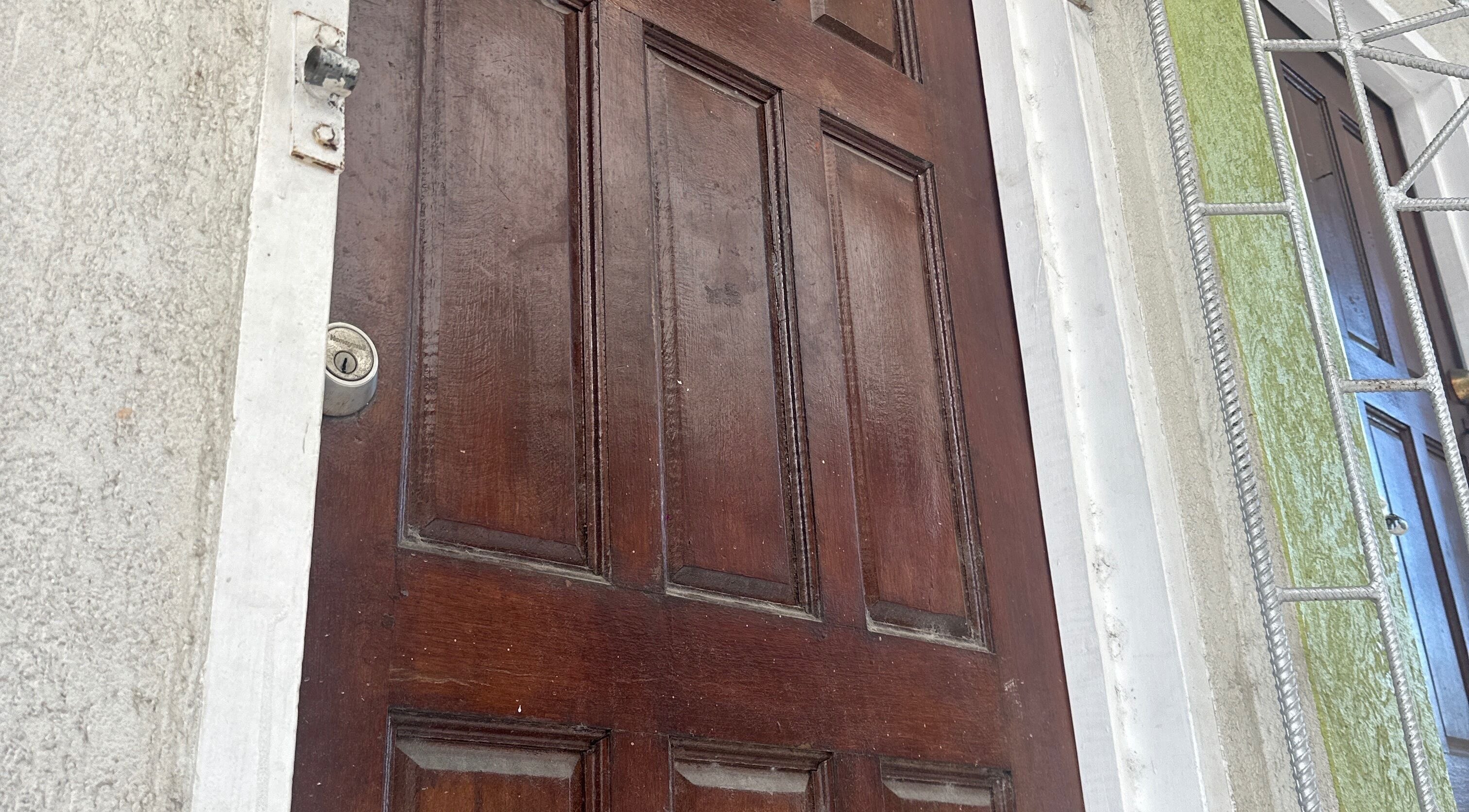Wooden door entrance of Beauty Canvas Studio, Georgetown, Demerara-mahaica, GY.