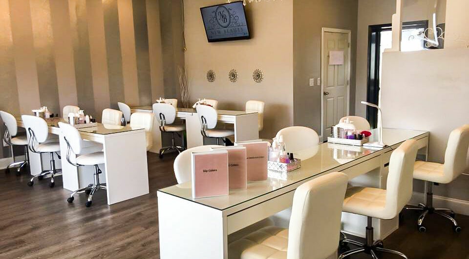 Interior of New Beauty Nail Lounge and Spa, Bellingham, Massachusetts, featuring elegant nail stations.