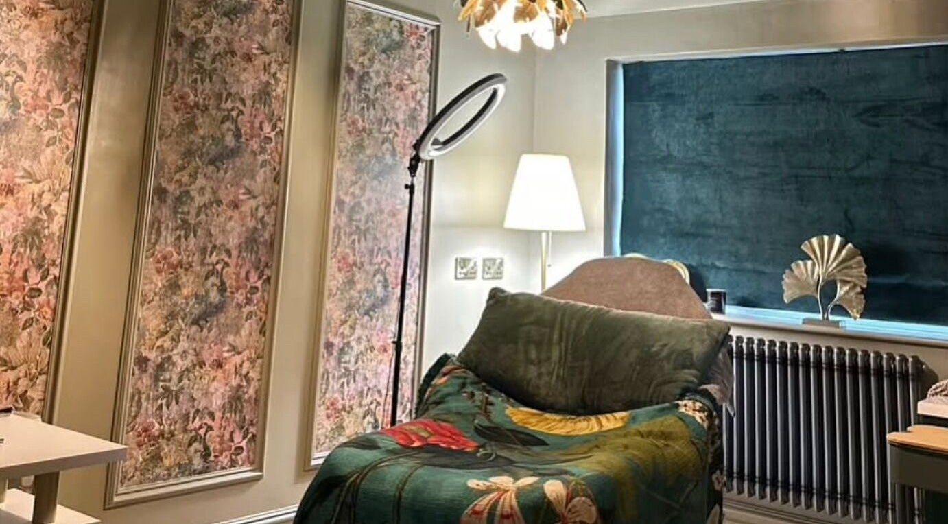 Cozy beauty room at Gigi Creatives in Gedling, England, GB with a floral bed and stylish decor.