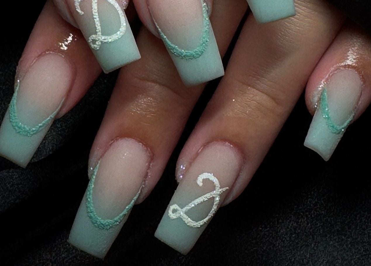 Intricate nail art with light blue and white designs at Beauty By Kristina Fa, Yagoona, New South Wales, AU.