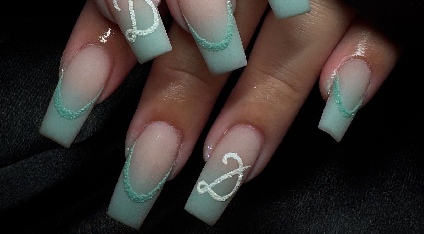 Intricate nail art with light blue and white designs at Beauty By Kristina Fa, Yagoona, New South Wales, AU.