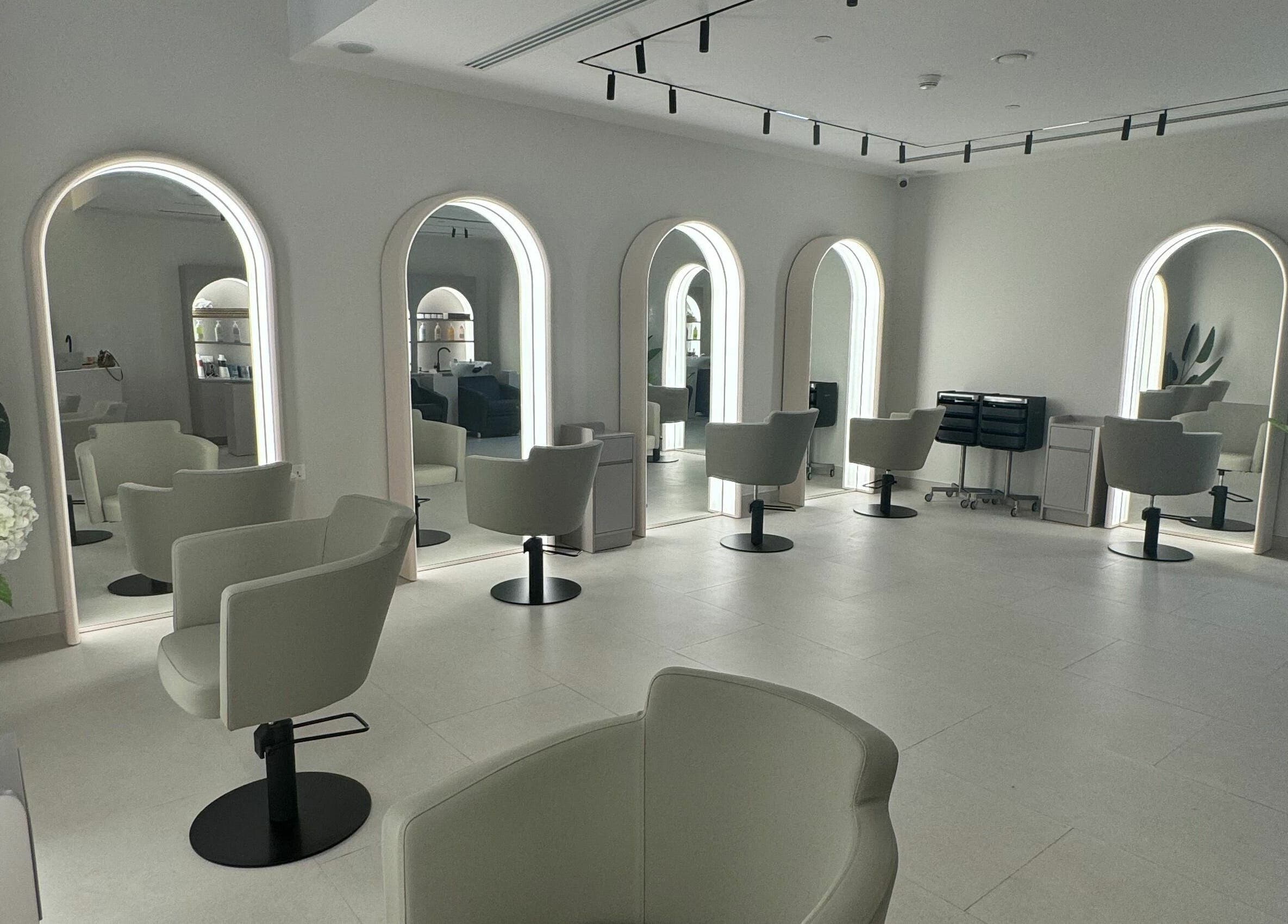 Sleek salon interior at Sasalon Dubai with modern chairs and mirrors in Dubai, Dubai, AE.