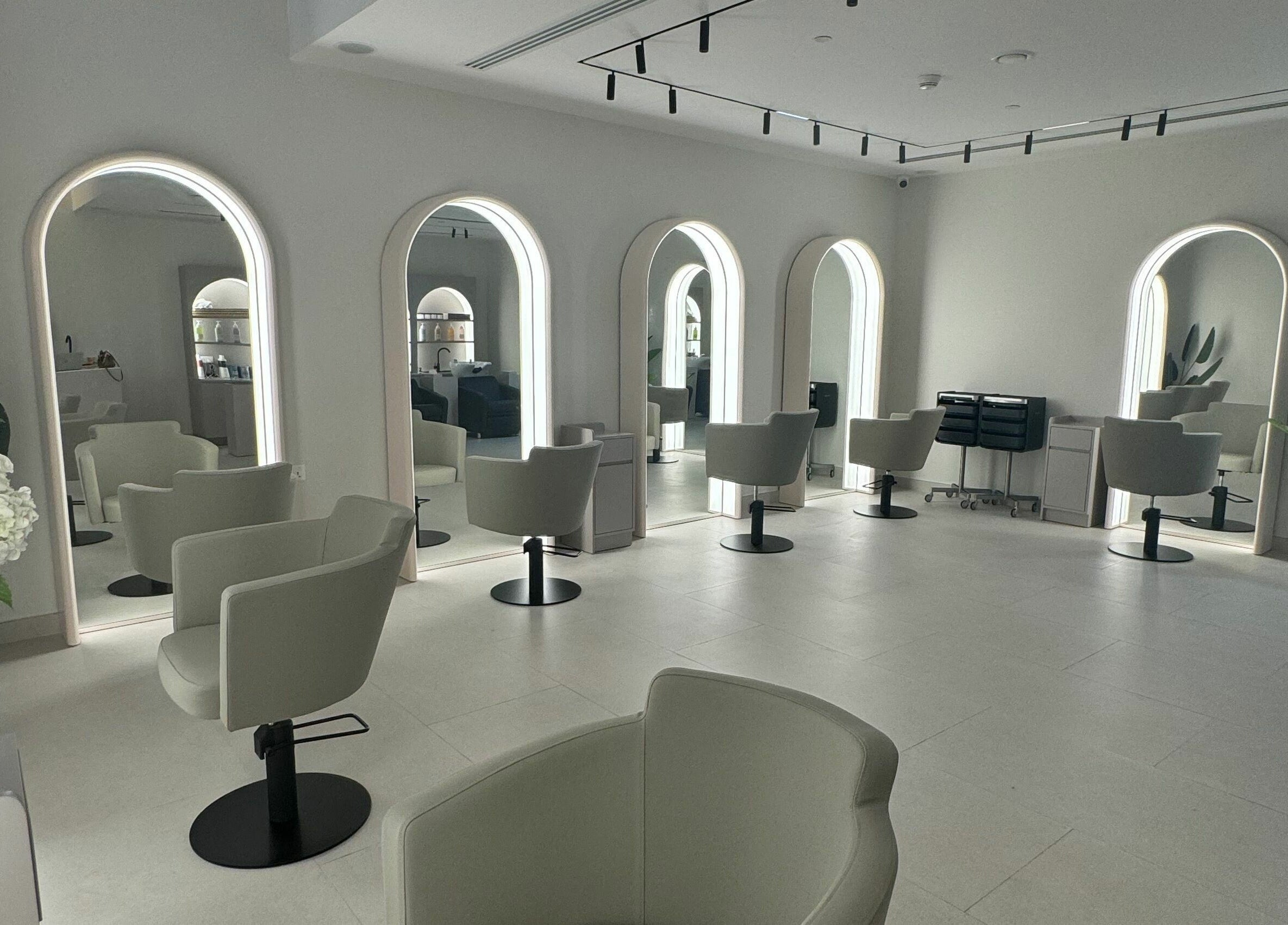 Sleek salon interior at Sasalon Dubai with modern chairs and mirrors in Dubai, Dubai, AE.