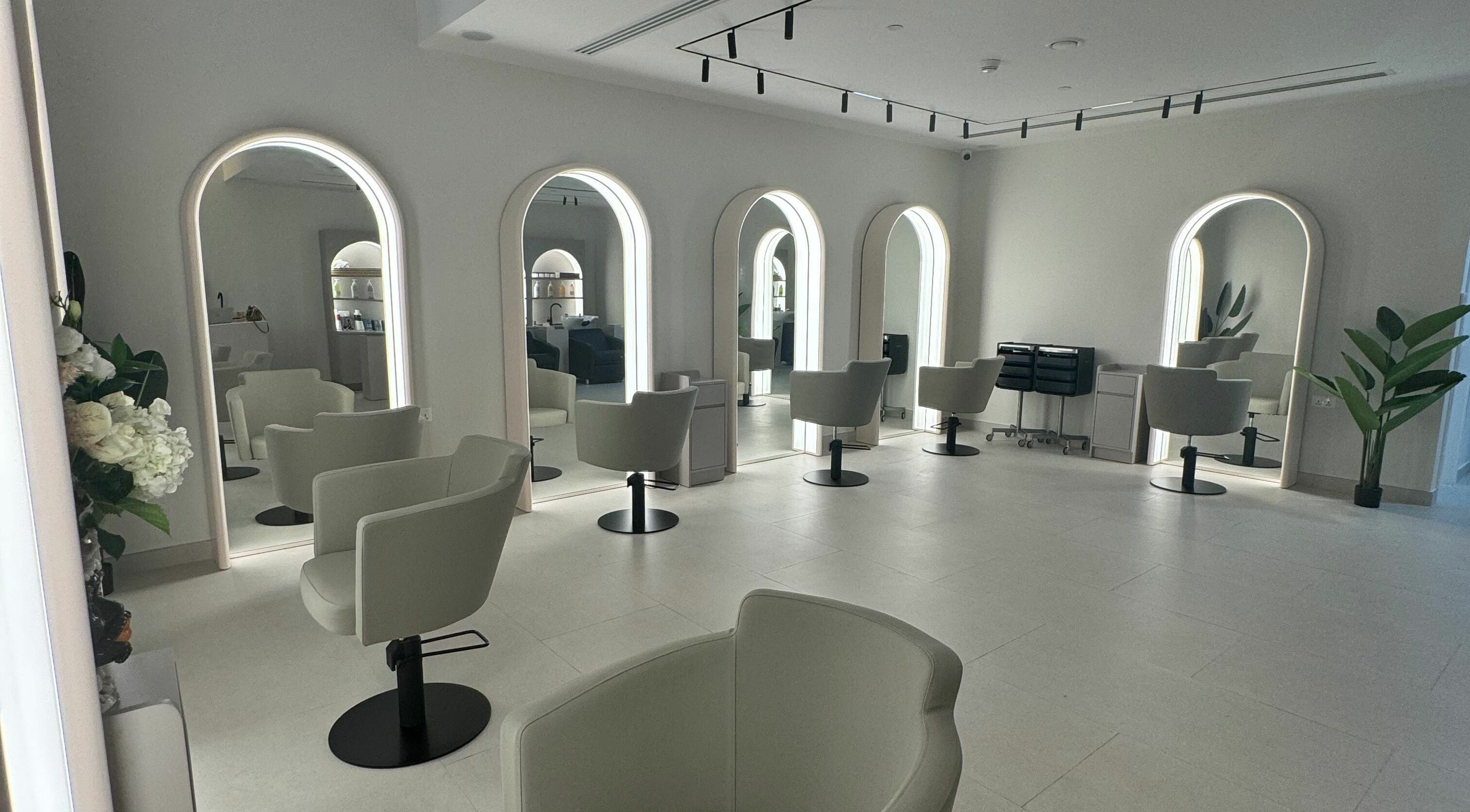Sleek salon interior at Sasalon Dubai with modern chairs and mirrors in Dubai, Dubai, AE.