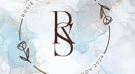 Elegant logo of Rosie Seftons Hair, located in March, England, GB, showcasing a stylish design with floral elements.