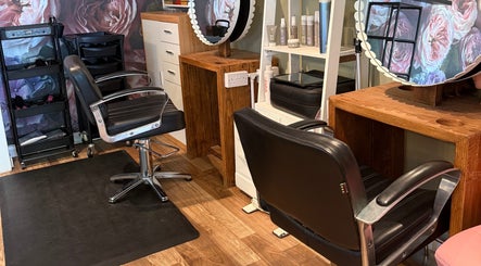 Elegant salon chairs and styling stations at Rosie Seftons Hair, March, England, GB.