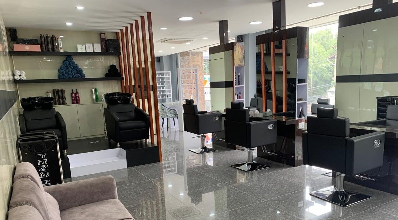 Modern interior of Bevel Unisex Salon in Kathmandu, Nepal with elegant styling stations and mirrors.