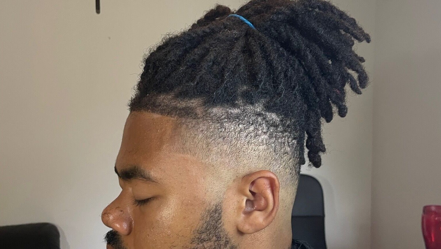 Detailed dreadlock style on a man at D.A Cutz, Halifax, Nova Scotia, CA.