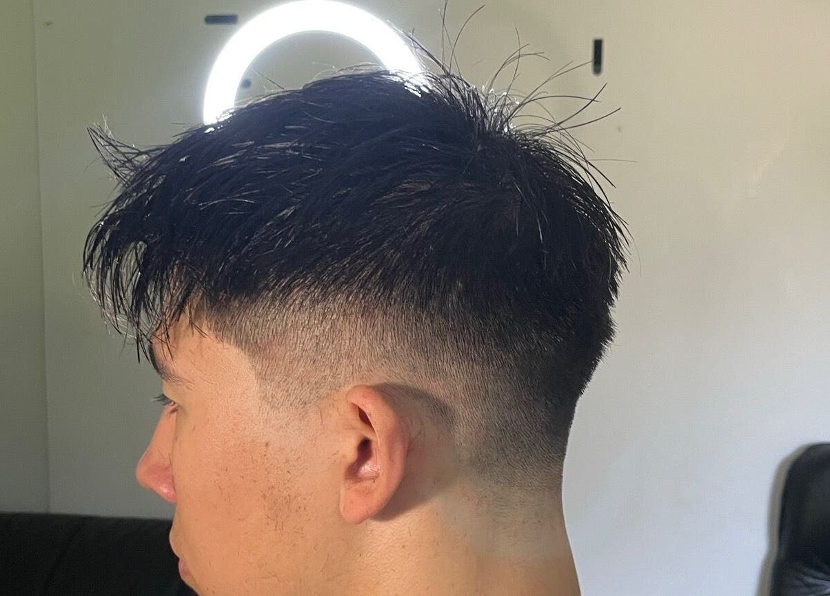 Close-up of a sleek fade hairstyle at D.A Cutz, Halifax, Nova Scotia, CA under professional lighting.