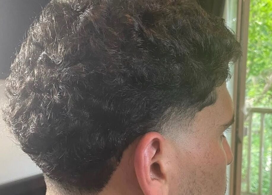 Fresh curly fade at D.A Cutz in Halifax, Nova Scotia, CA highlighting expert styling.