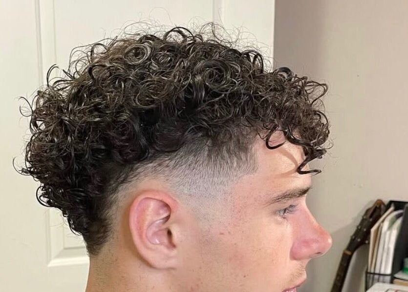 Stylish curly fade haircut at D.A Cutz in Halifax, Nova Scotia, CA. Trendy and sharp.