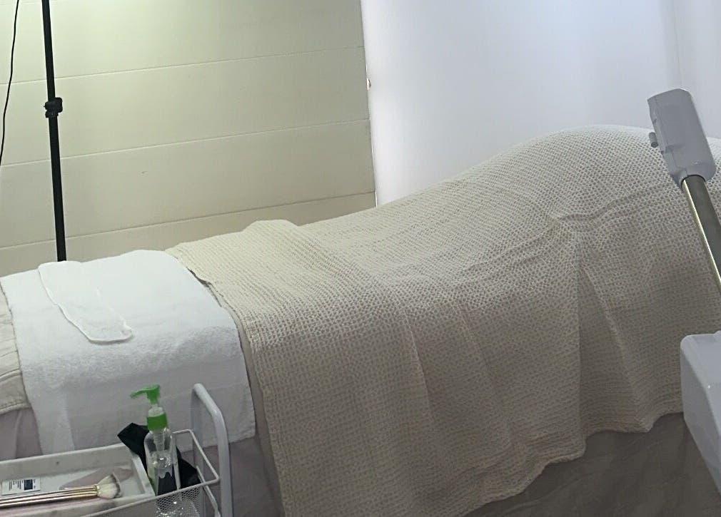 Relaxing treatment room at Glowy With B, Melbourne, Victoria, AU, featuring a cozy bed and spa equipment.