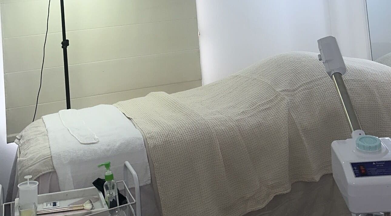 Relaxing treatment room at Glowy With B, Melbourne, Victoria, AU, featuring a cozy bed and spa equipment.