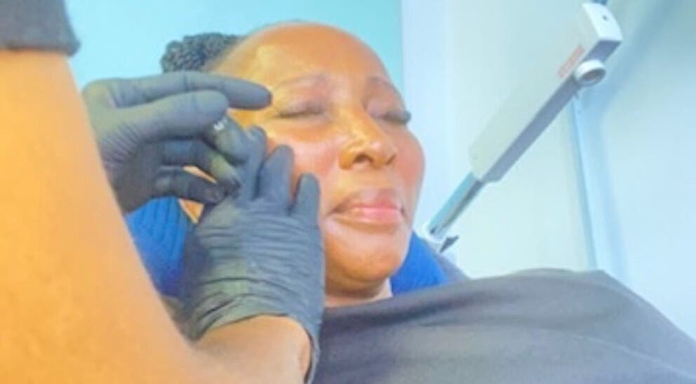 Facial treatment at DK HARMONY WELLNESS & MEDSPA, Johannesburg, Gauteng, ZA. Client enjoys soothing skincare service.