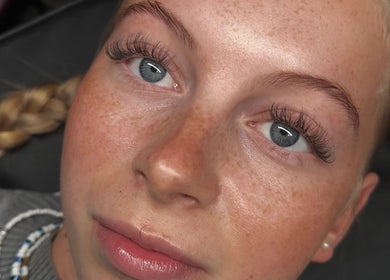Close-up of enhanced lashes at Evara Amore, London, England, GB showcasing delicate beauty artistry.
