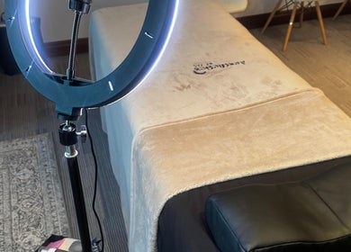 Cozy spa bed and ring light at Aestheticsby.Yas, Sandton, Gauteng, ZA for ultimate wellness experience.
