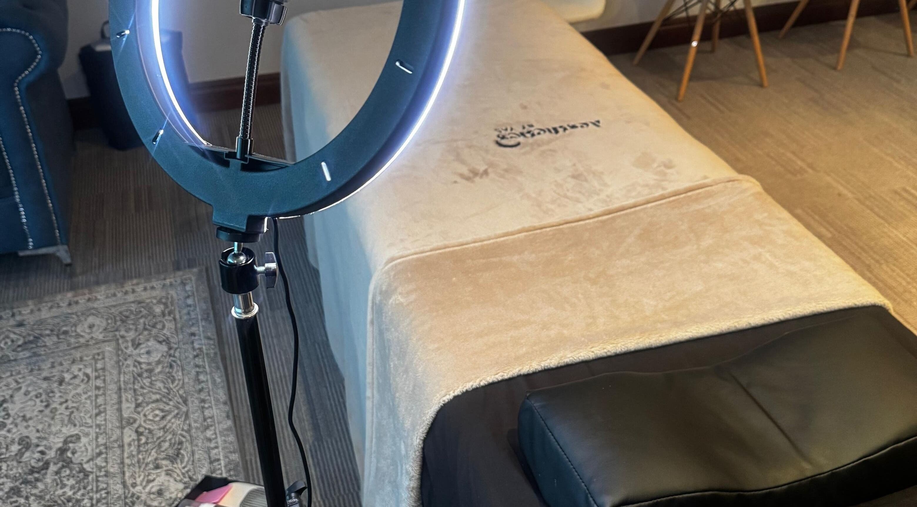 Cozy spa bed and ring light at Aestheticsby.Yas, Sandton, Gauteng, ZA for ultimate wellness experience.