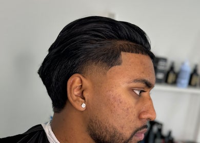 Fresh fade haircut at Fergo Blends, Leppington, New South Wales, AU, showcasing barber expertise.