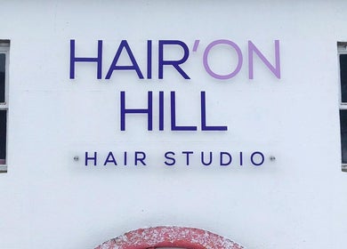 Hair’On Hill sign outside beauty studio in Caledon, Northern Ireland, GB.