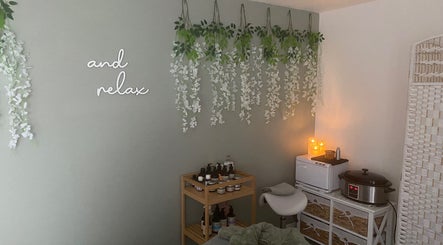 Relaxing massage room at Massage & Wellness Sanctuary, Winchburgh, Scotland, GB with serene decor and ambient lighting.