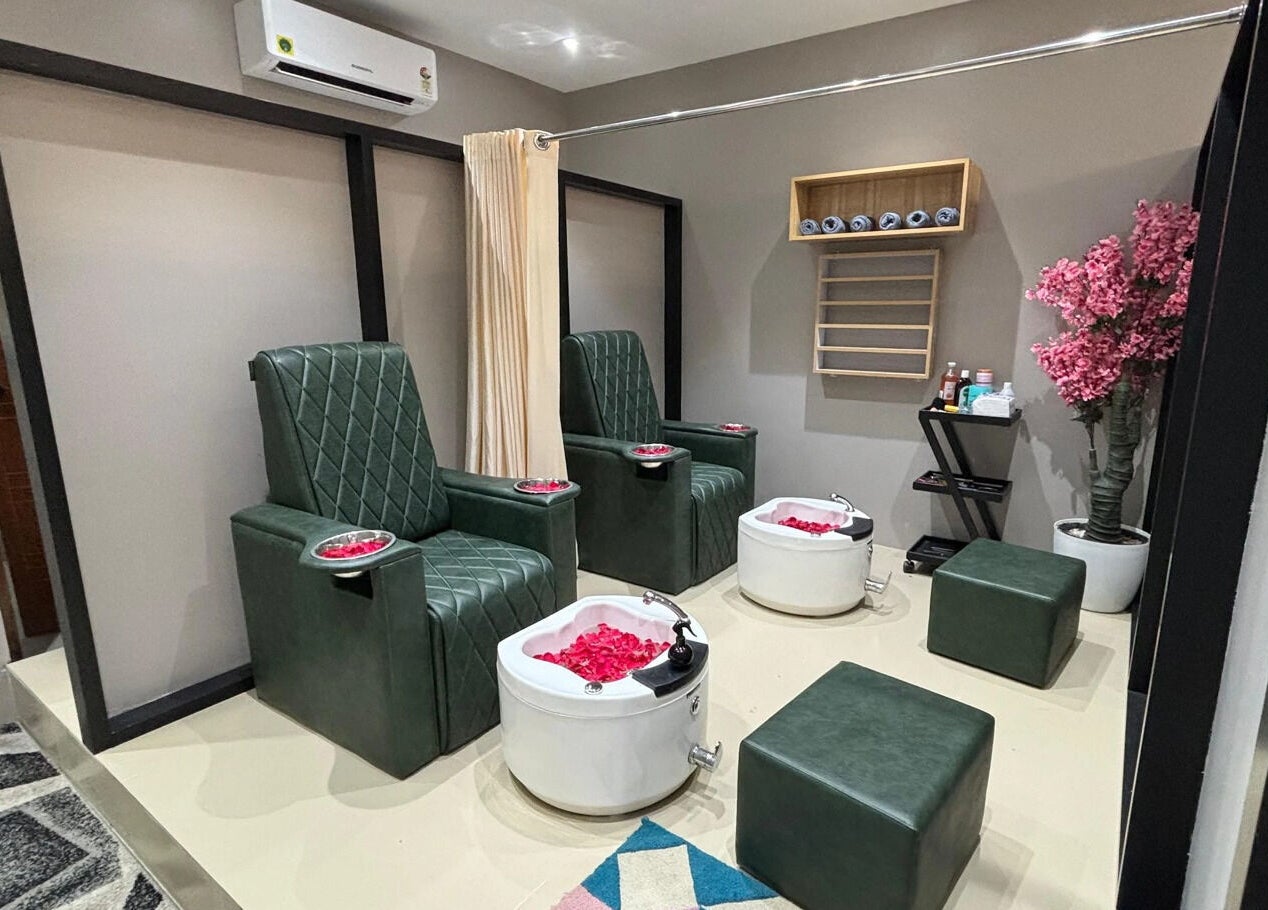 Luxurious pedicure chairs with rose petals at EVERMOR ANCHAL, ANCHAL, Kerala, IN offer a serene spa experience.