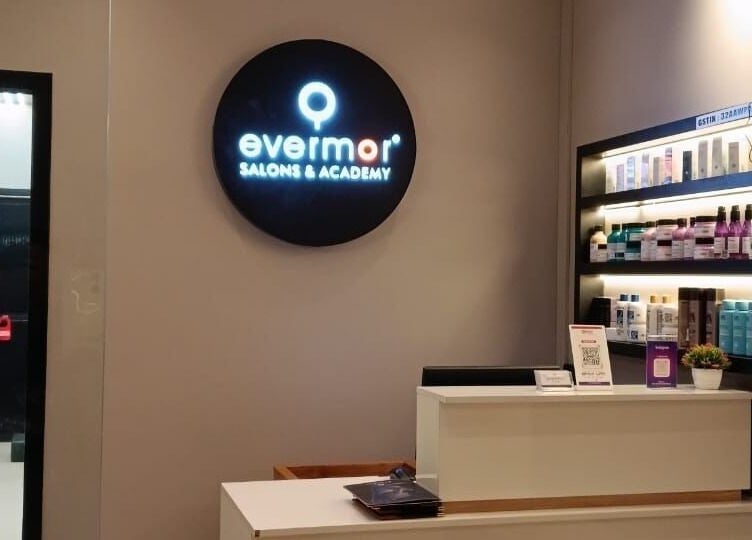 Reception area at EVERMOR ANCHAL salon, featuring product shelves, ANCHAL, Kerala, IN.