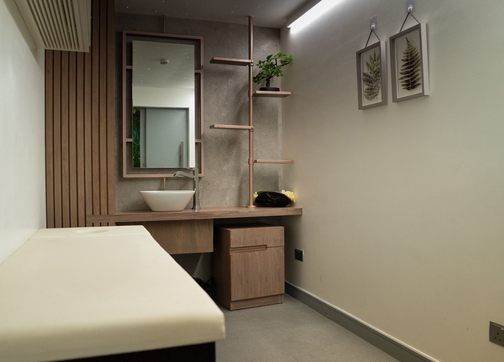 Elegant spa treatment room at Spartan Fitness & Spa District in al janabiyah, featuring minimalist decor.