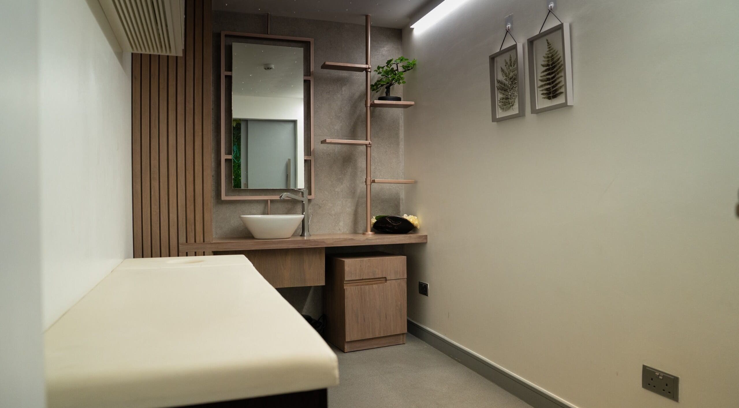 Elegant spa treatment room at Spartan Fitness & Spa District in al janabiyah, featuring minimalist decor.