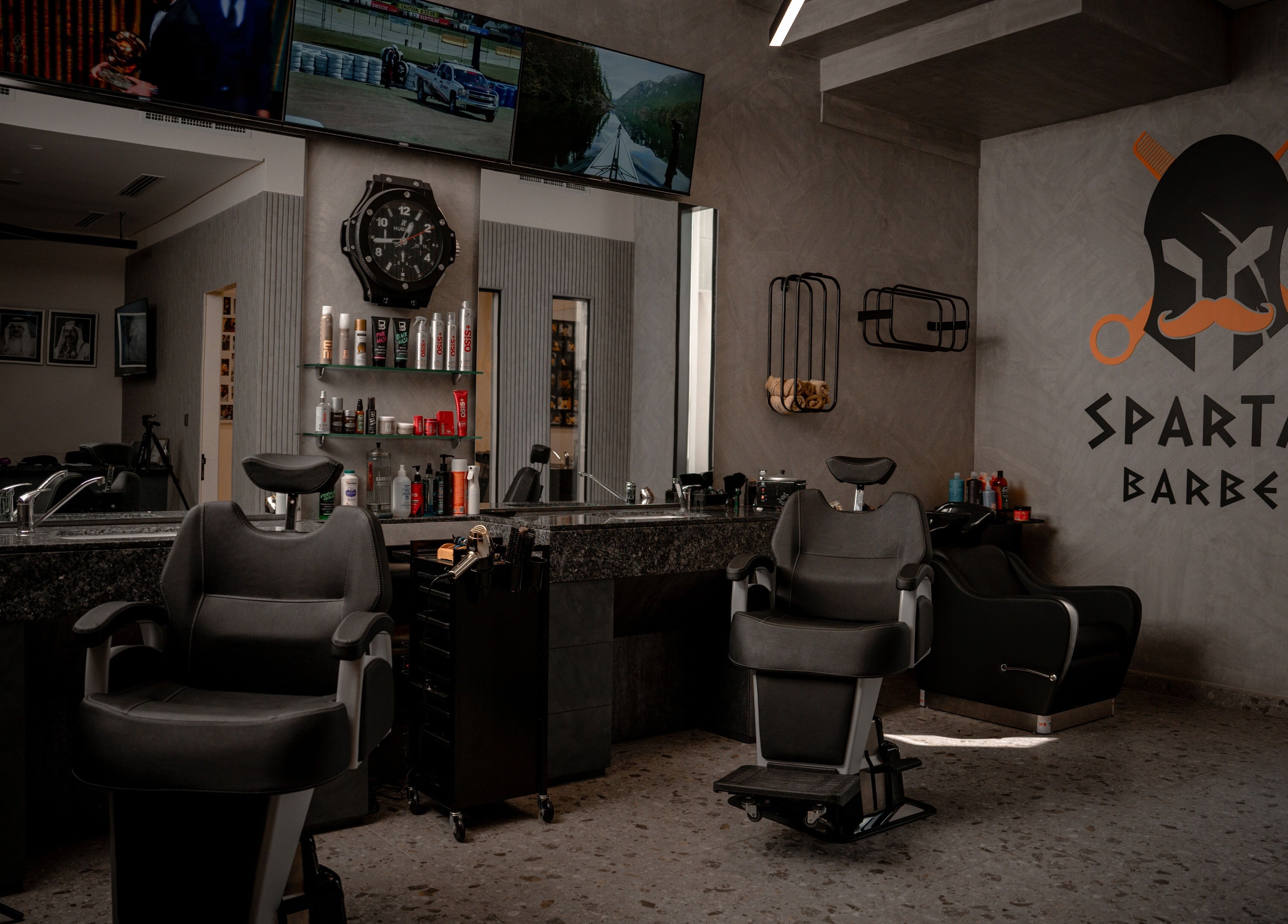 Stylish interior of Spartan Barber WLL in Saar, Al-muḥāfaẓat Aš-šamālīyah, BH, featuring modern barber chairs.