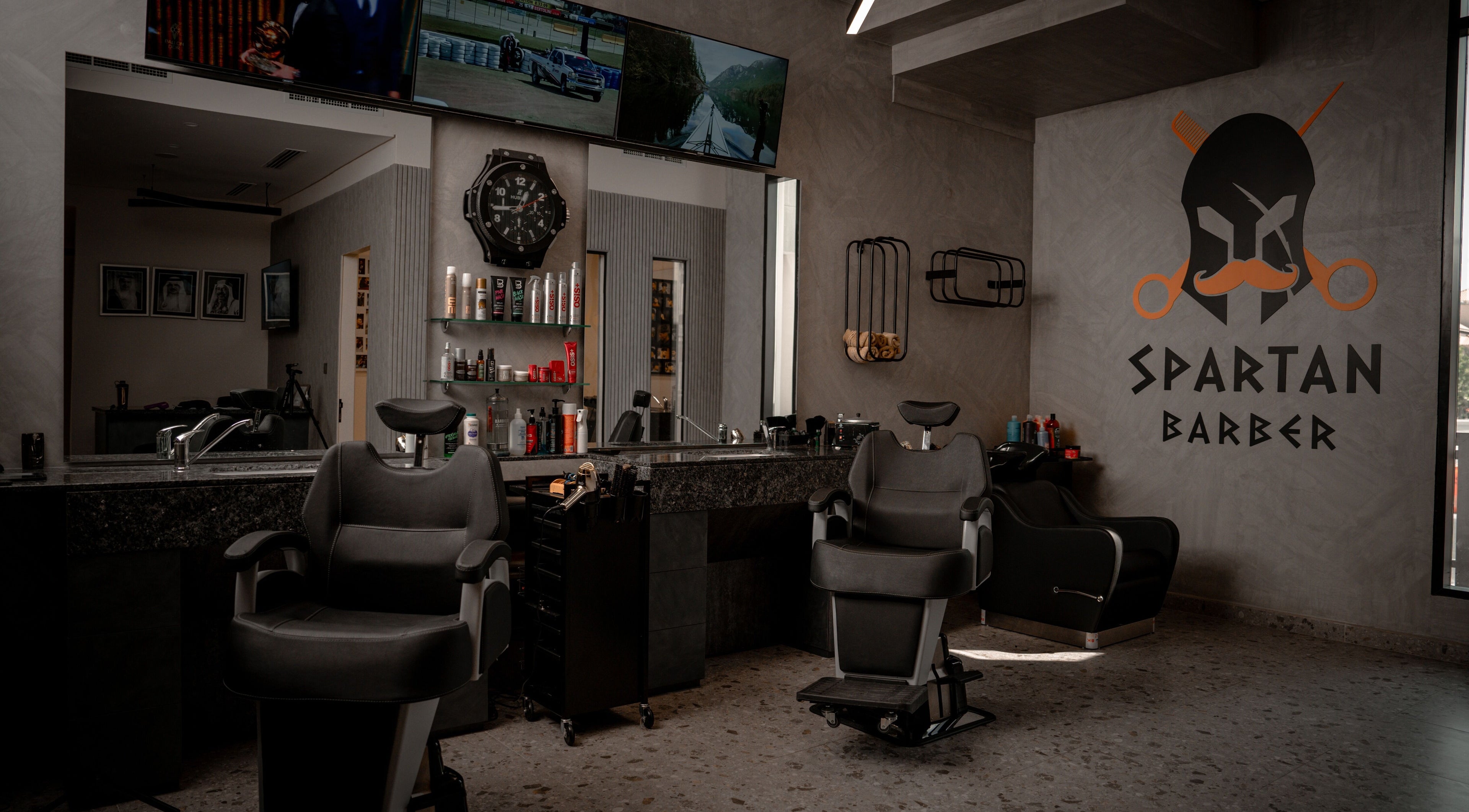 Stylish interior of Spartan Barber WLL in Saar, Al-muḥāfaẓat Aš-šamālīyah, BH, featuring modern barber chairs.