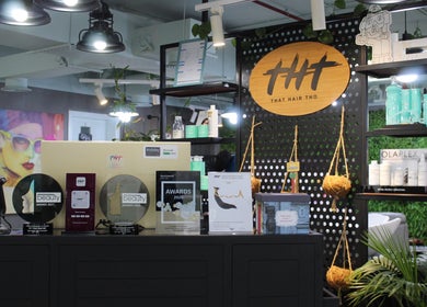 Awards and products displayed at THT - That Hair Tho, Dubai, Dubai, AE salon interior.