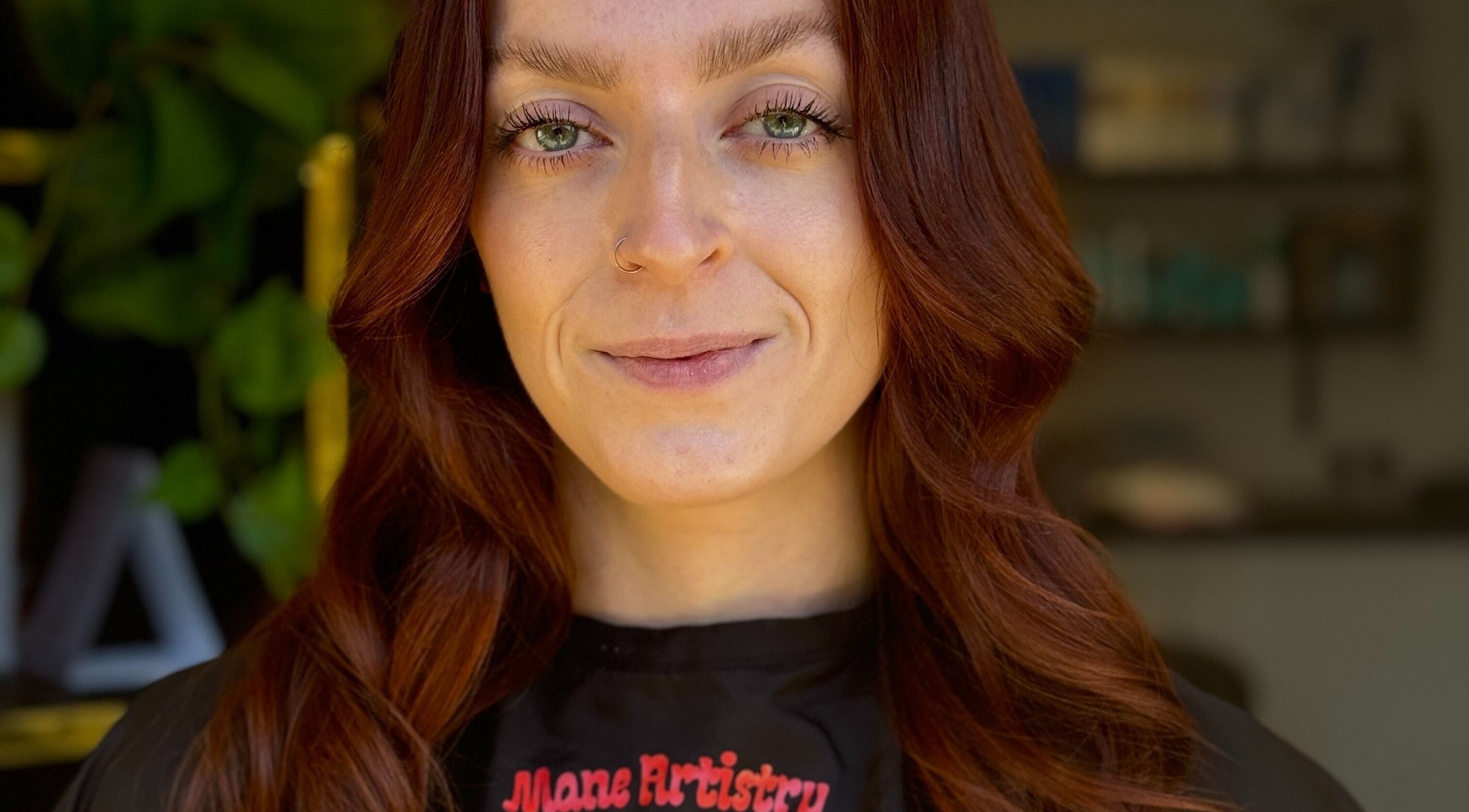 Customer with styled hair at Mane Artistry By Jay, Hertfordshire, GB, showcasing vibrant salon expertise.