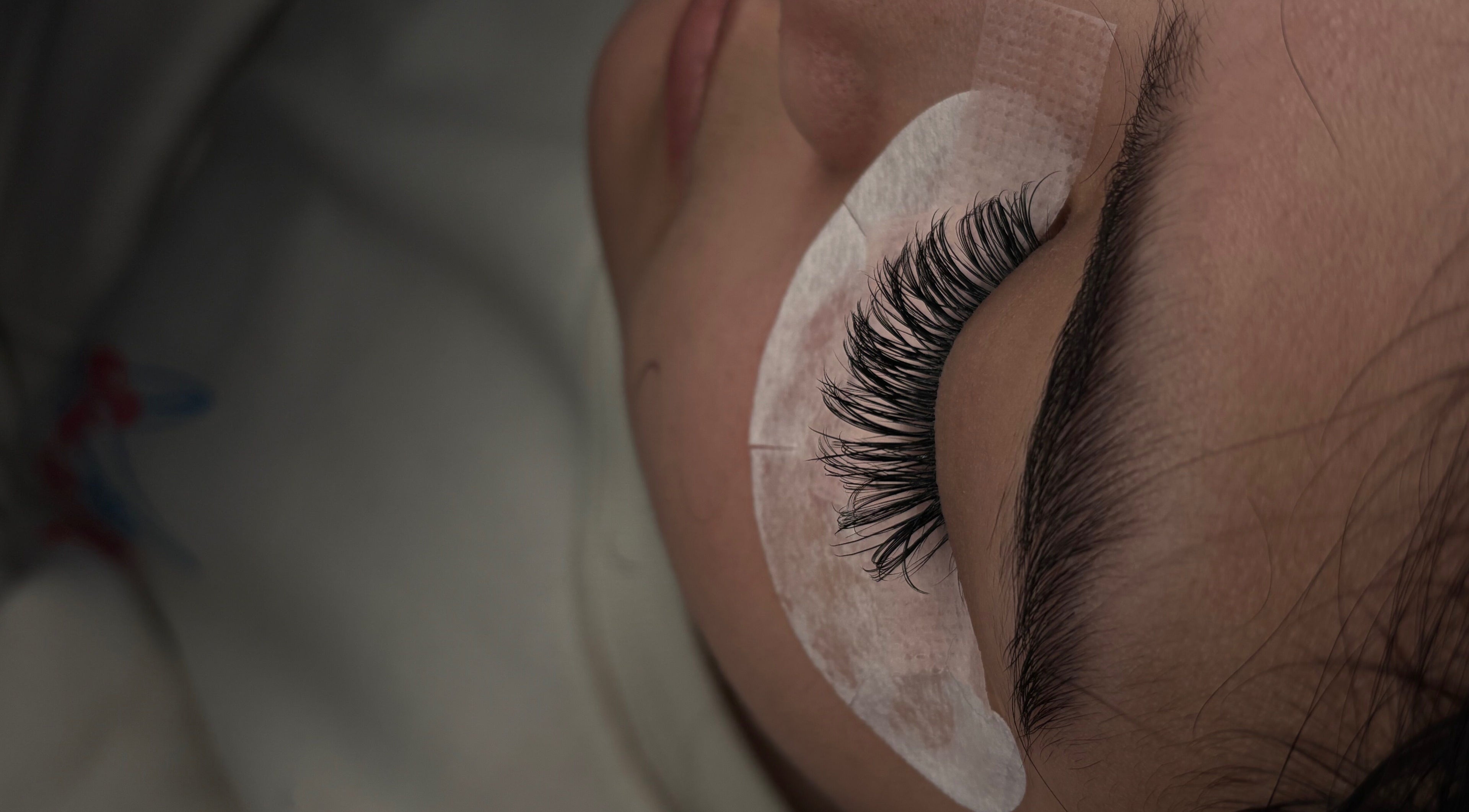 Eyelash extension applied at Winks and Minks, Elkhart, Indiana, US, showcasing precise beauty techniques.