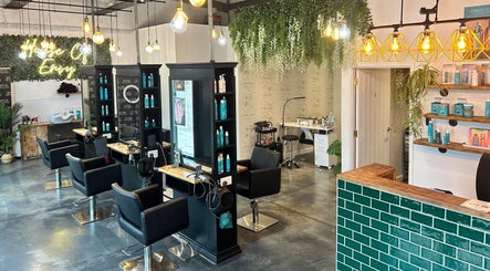 Chic interior of House Of Envy Longford in Gloucester, England, GB with stylish salon setup and vibrant decor.