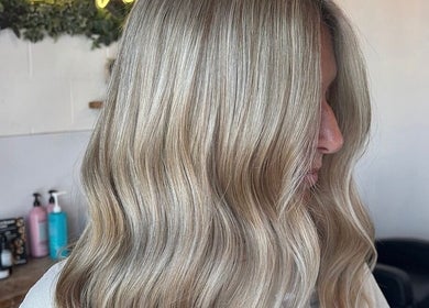 Flowing blonde hair styled at House Of Envy Longford, Gloucester, England, GB for a chic and radiant appearance.