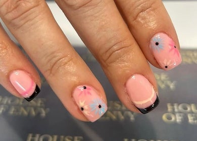 Floral French manicure at House Of Envy Longford in Gloucester, England, GB featuring pink and black accents.